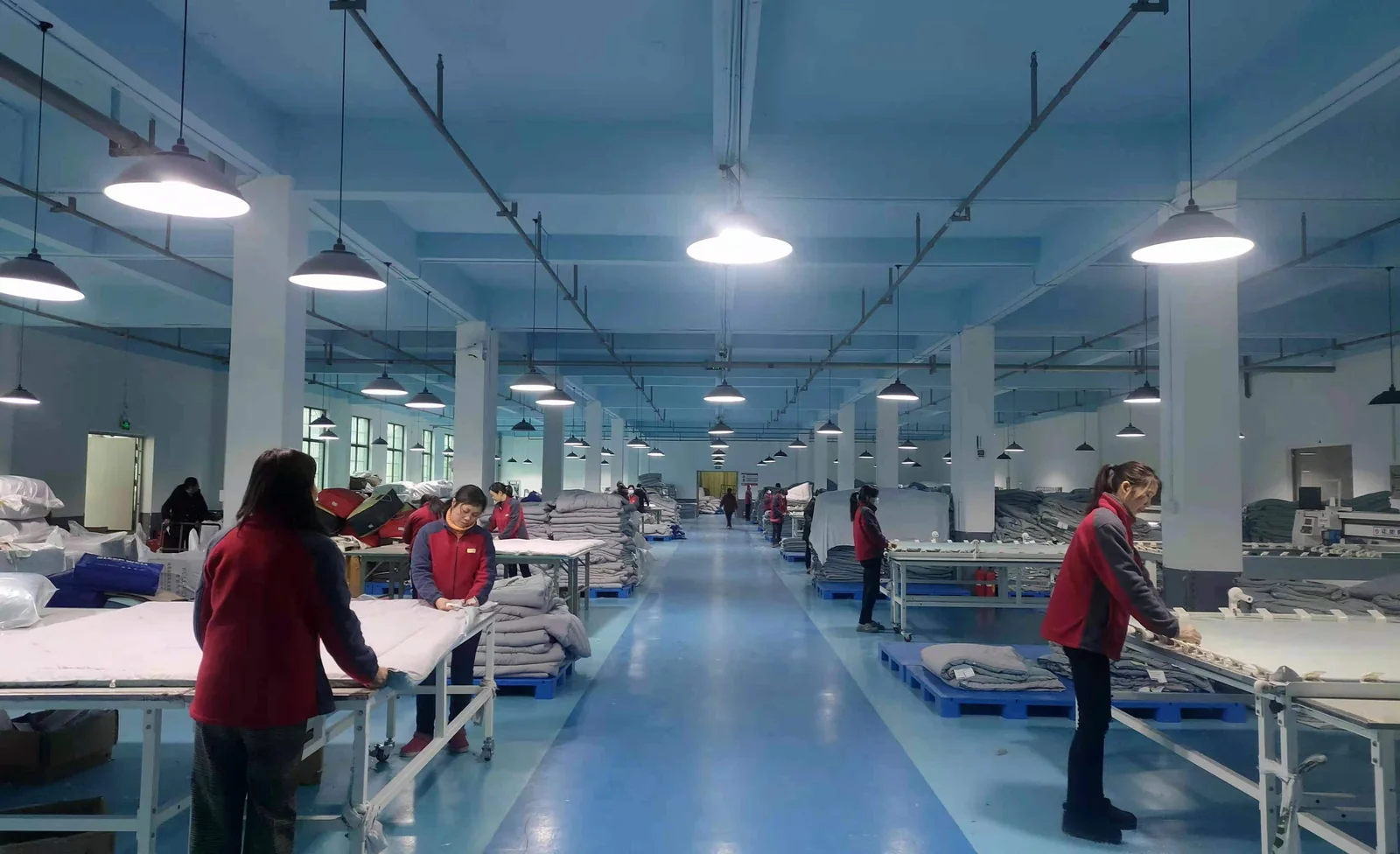 bedding products and worktables in the factory assembly area