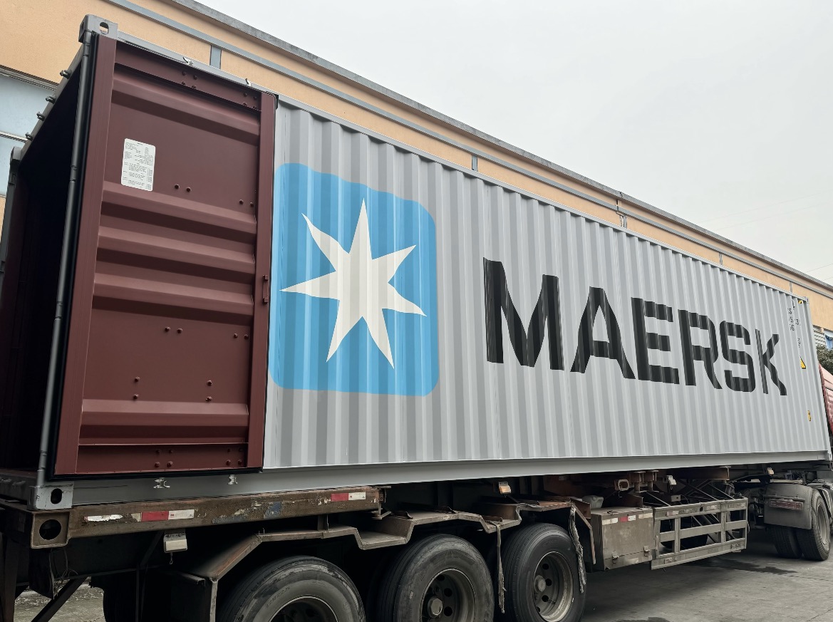 Cartons positioned at a container for a bedding shipment