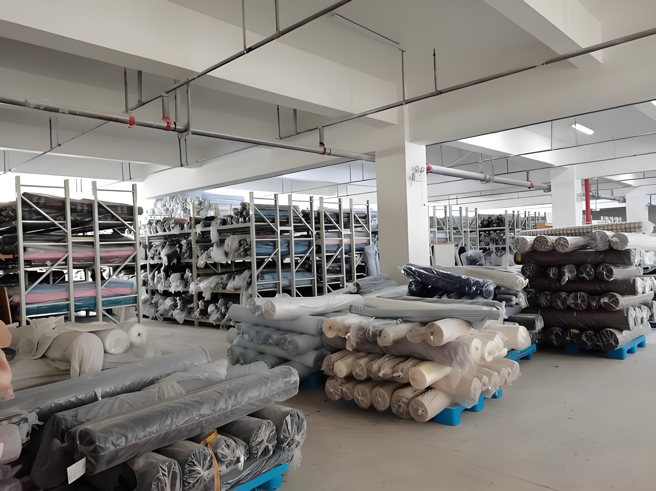 bedding fabric rolls in the factory material storage area